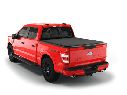 Red Ford F-150 with loaded and expanded Sawtooth Stretch pickup truck bed cover