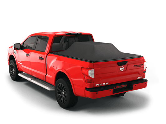 Red Nissan Titan with loaded and expanded Sawtooth Stretch pickup truck bed cover