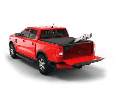 Red Ford Ranger with Sawtooth Stretch expandable tonneau cover rolled up at cab