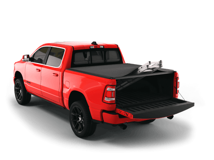 Red Ram 1500 with Sawtooth Stretch expandable tonneau cover rolled up at cab