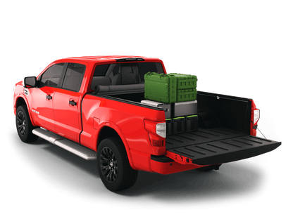 Red Nissan Titan with gear in the truck bed and the Sawtooth Stretch tonneau cover rolled up at cab 