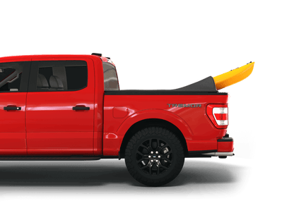 Red Ford F-150 with yellow kayak under sawtooth stretch truck bed cover