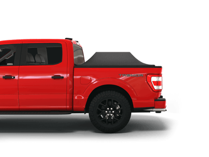 Red Ford F-150 with Sawtooth Stretch tonneau cover expanded over cargo load