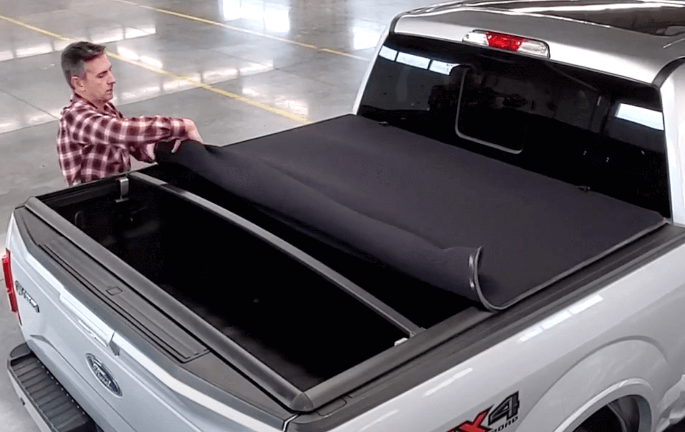 Silver Ford F-150 with snow covered Sawtooth Stretch tonneau