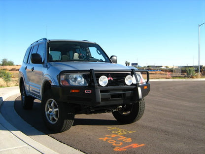 ARB Deluxe Bar Off-Road Front Bumper Fits 2000-2004 Mitsubishi Montero - Black Steel, Winch, Tow Hooks & Antenna Mount (1 pc)