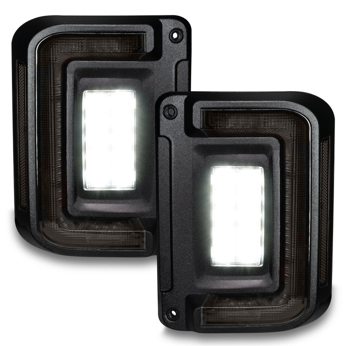 LED Tail Light Assembly; tinted lens, black housing, flush mount, high-powered reverse light; clear bulb; set of 2; plug-and-play installation.